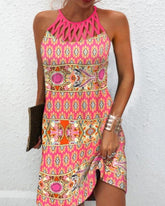 Ärmlös klänning med halternecktryck